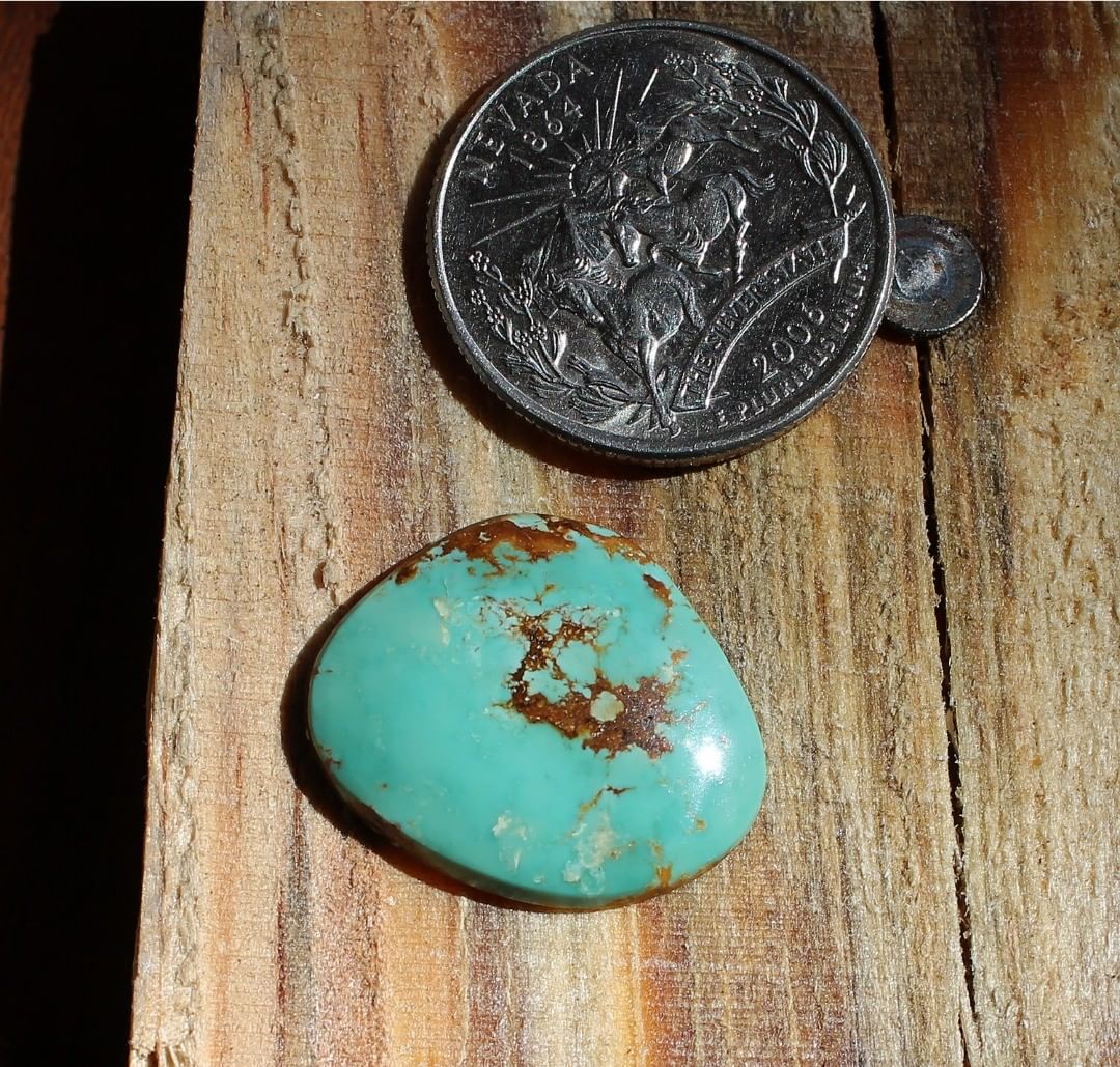 A blue natural turquoise cabochon with red matrix (Stone Mountain Turquoise)
Instagram    $22 for 7.6 carats untreated Nevada turquoise.
