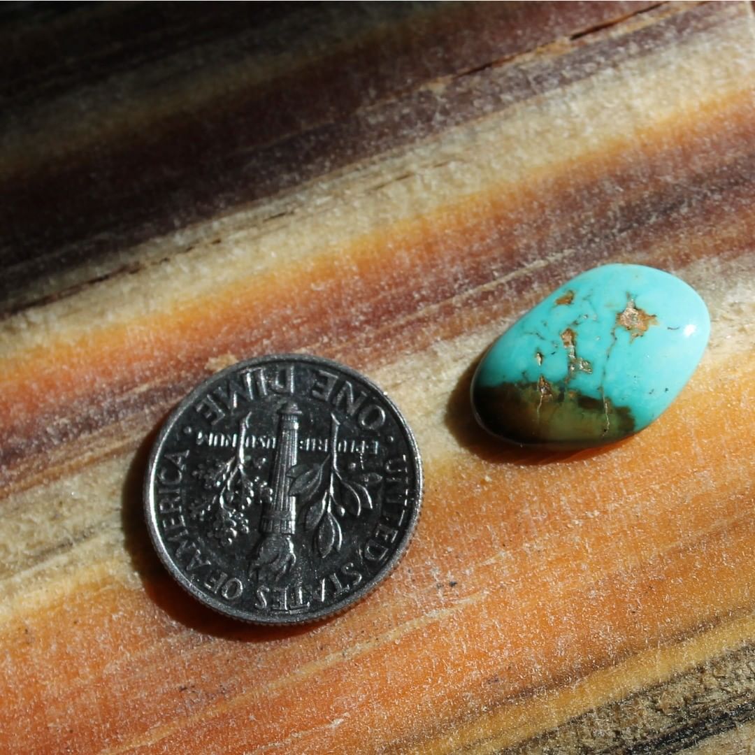Blue Nevada Turquoise with red inclusions (Singatse Turquoise) 
Contact us  $11.67 for 3.6 carats untreated & un-backed Nevada turquoise.
