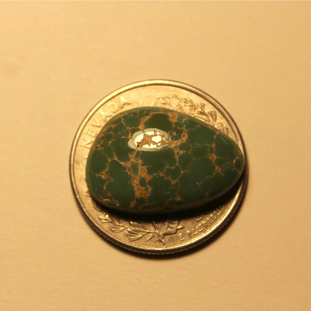 Green turquoise spiderweb cabochon from Crescent Valley in Nevada 
Contact us  $35.12 for 12.7 carats un-backed & untreated
