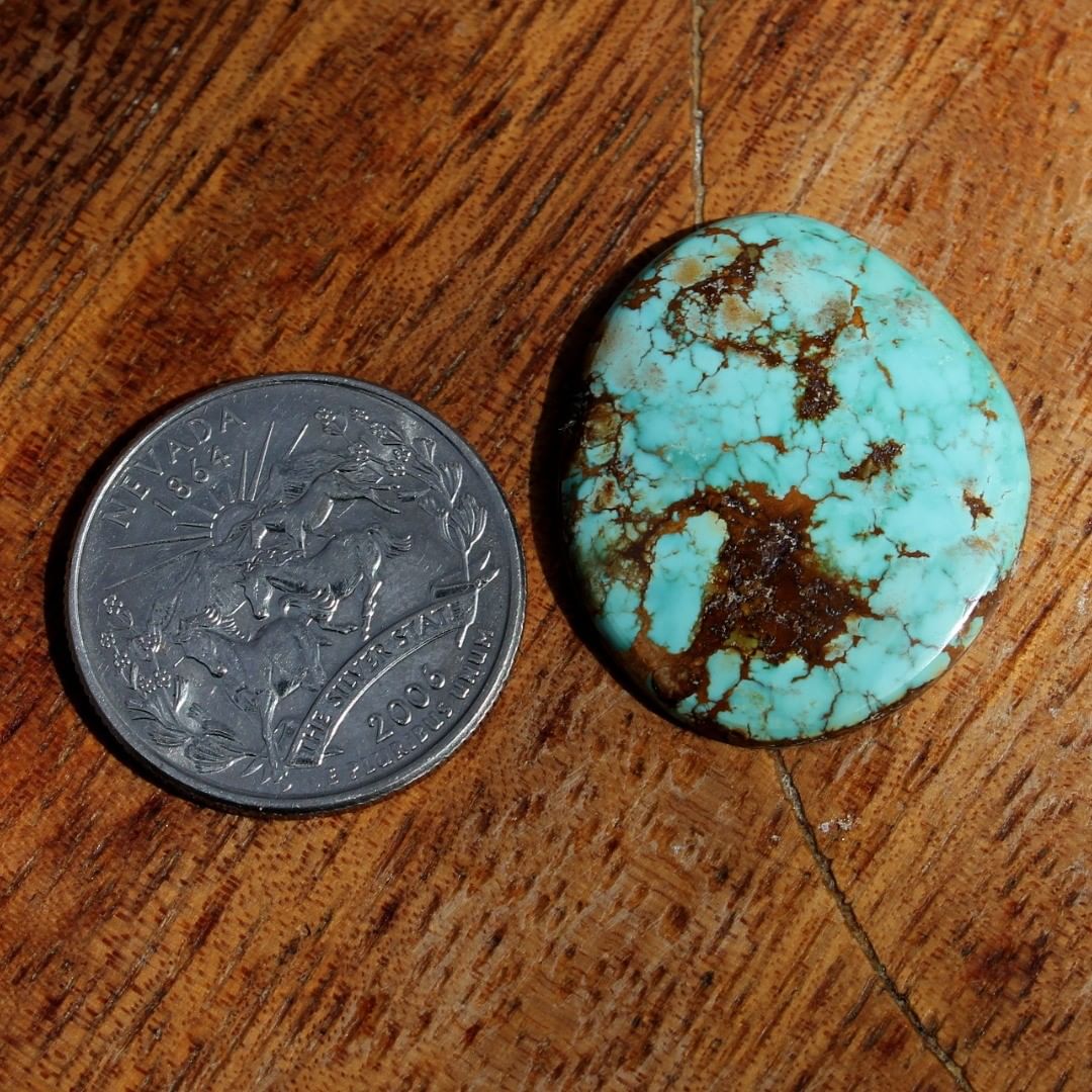 Natural blue turquoise cabochon with red matrix (Stone Mountain Turquoise)
Instagram    $75 for 23.1 carats untreated Nevada turquoise. 

