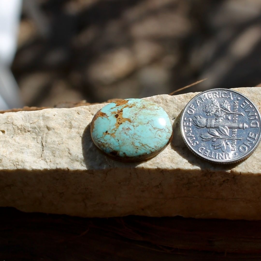 Natural light blue Stone Mountain Turquoise cabochon w/ red inclusions
Instagram    $25 for 8.6 carats untreated & un-backed Nevada turquoise.
