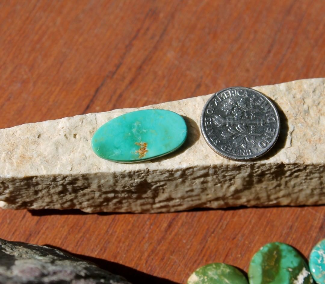 A natural teal green turquoise cabochon oval (Stone Mountain Turquoise)
 $16 for 5.8 carat untreated Nevada turquoise.
