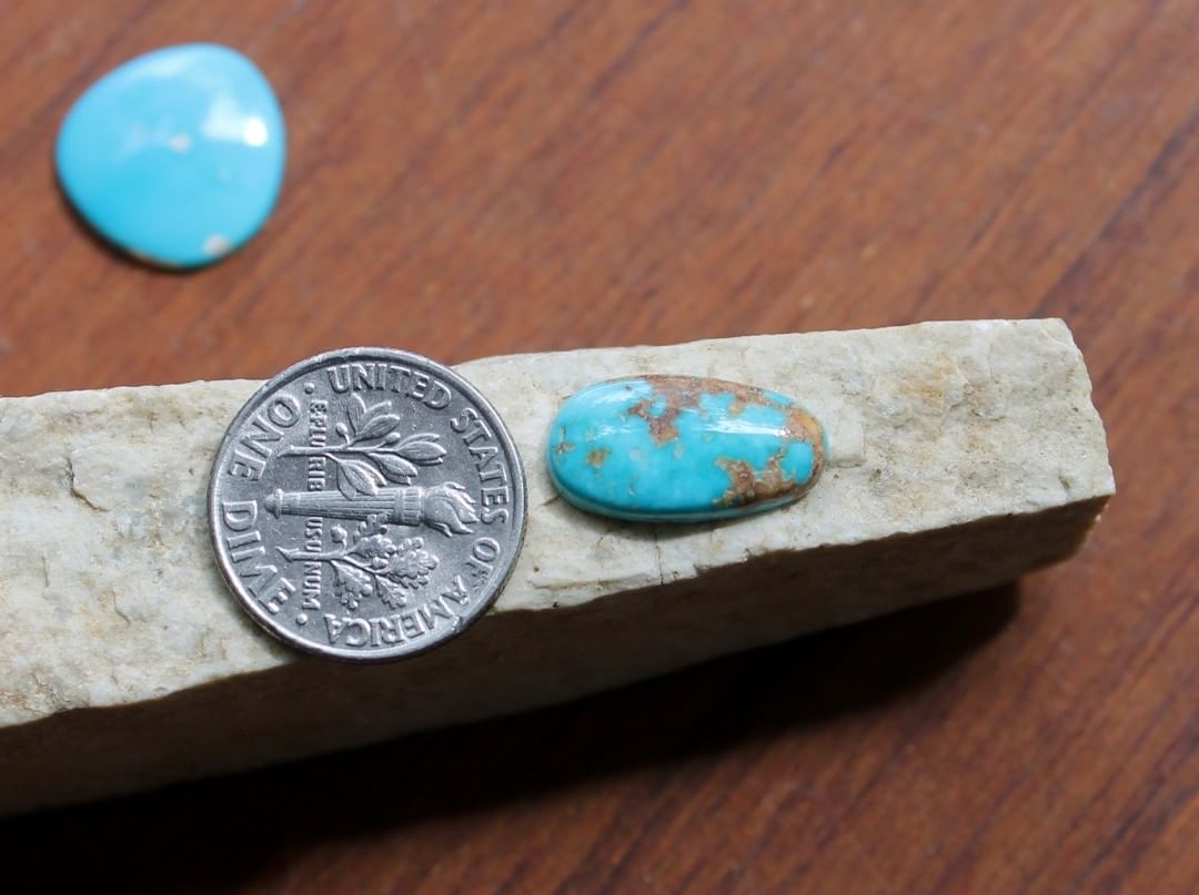 Natural blue Stone Mountain Turquoise cabochon w/ red matrix
 $11 for 3.8 carats untreated & un-backed Nevada turquoise.

