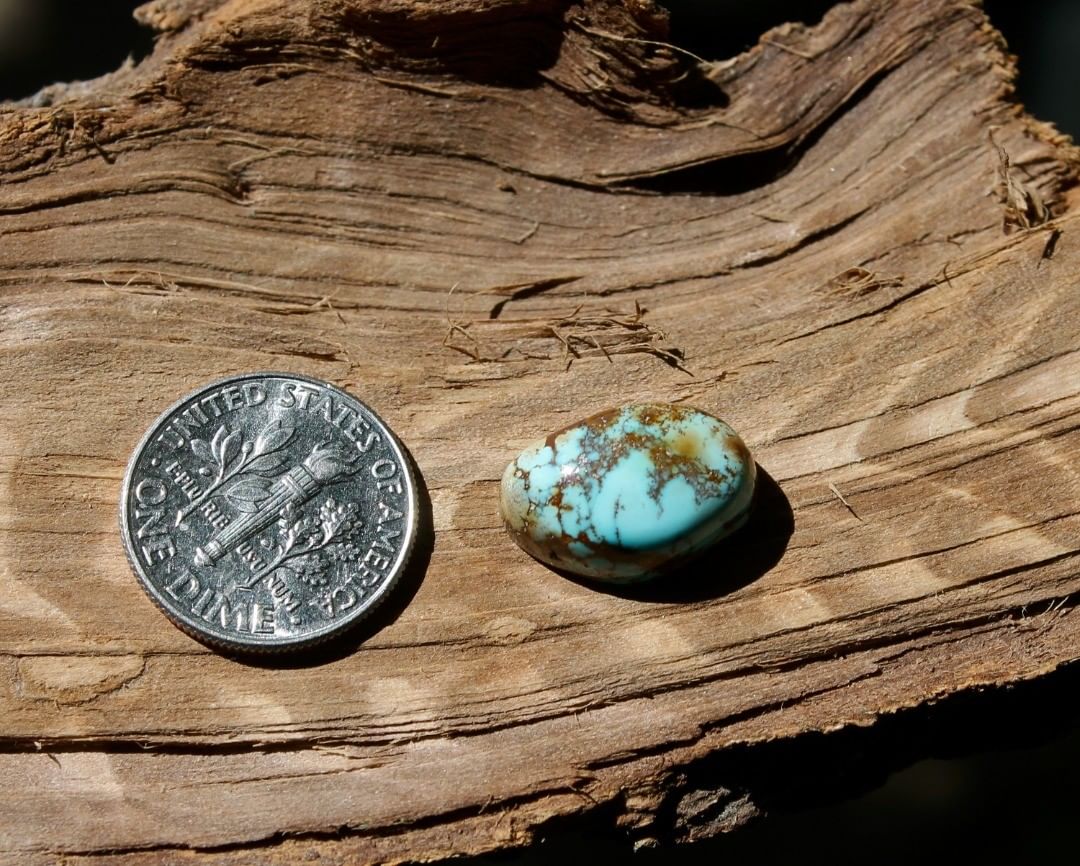 Natural blue Stone Mountain Turquoise cabochon w/ tall dome and red inclusions
 $23 for 7.9 carats untreated & un-backed Nevada turquoise.
