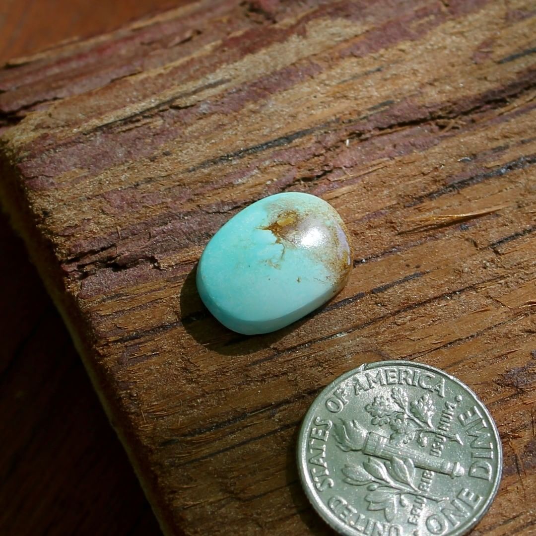 Natural blue Stone Mountain Turquoise cabochon w/ red matrix
 $16 for 5.6 carats untreated & un-backed Nevada turquoise.
