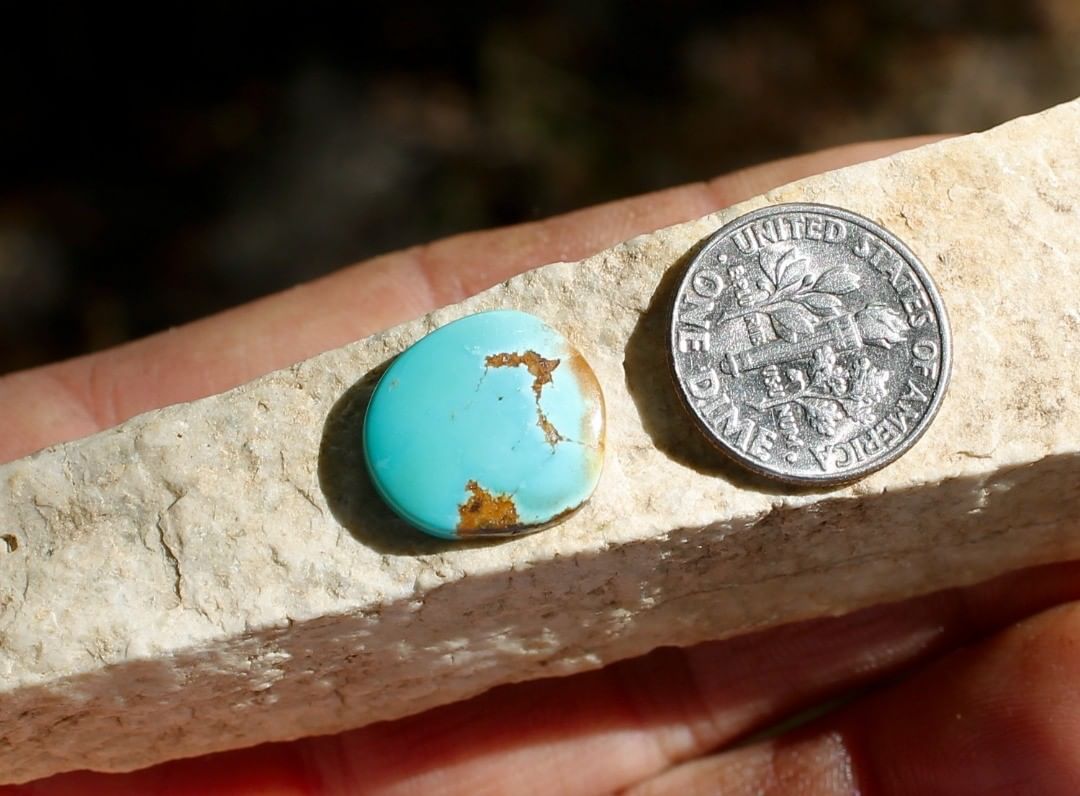 Natural blue Stone Mountain Turquoise cabochon w/ red inclusions
 $15 for 5.2 carats untreated & un-backed Nevada turquoise.
