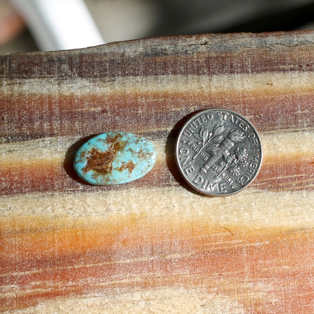 Natural blue Stone Mountain Turquoise cabochon w/ red inclusions
 $11 for 3.8 carats untreated & un-backed Nevada turquoise.

