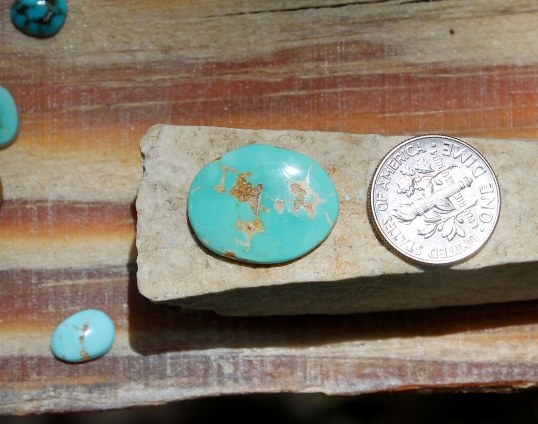 Natural bright blue Stone Mountain Turquoise cabochon w/ flat dome
 $20 for 7.6 carats untreated & un-backed Nevada turquoise.
