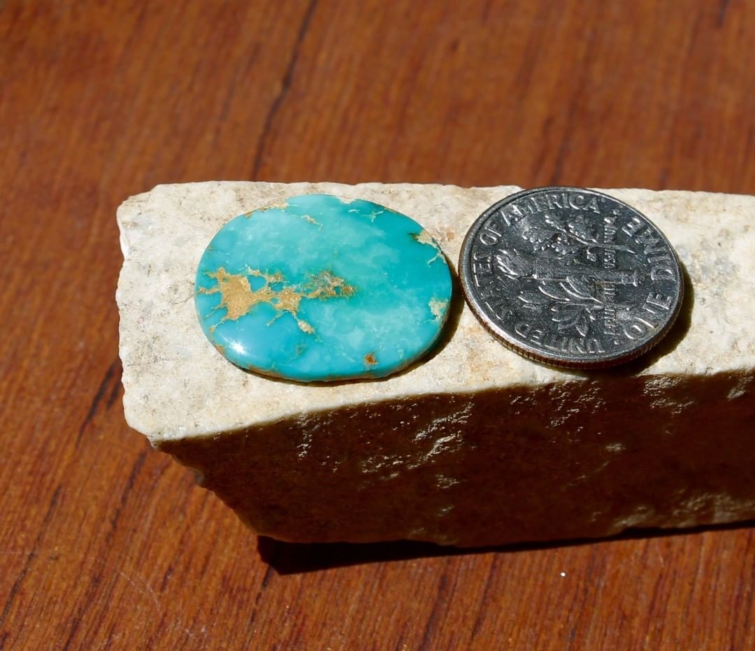 Natural deep blue Stone Mountain Turquoise cabochon
 $18 for 7.8 carats untreated Nevada turquoise. This stone has some natural hostrock backing. 
