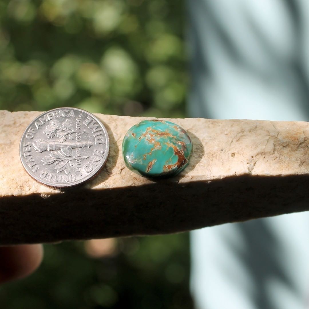 Natural dual color Stone Mountain Turquoise cabochon w/ red matrix
 $14 for 4.8 carats untreated & un-backed Nevada turquoise. 
