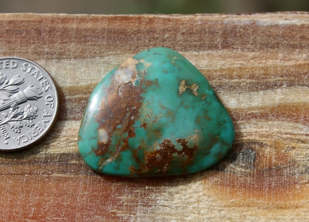 Natural green Stone Mountain Turquoise cabochon w/ interesting patterns
 $54 for 19.2 carats untreated & un-backed Nevada turquoise. 
