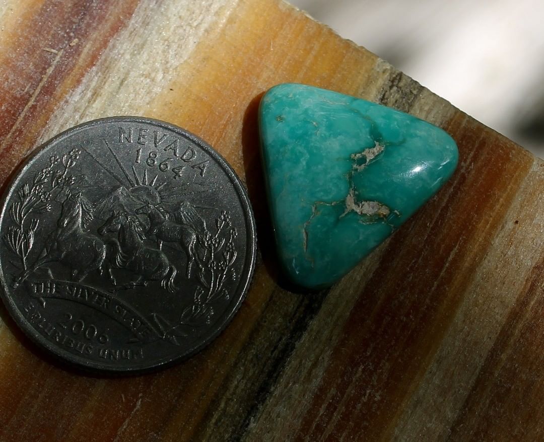 Natural green Stone Mountain Turquoise cabochon triangle
 $27 for 9.4 carats untreated & un-backed Nevada turquoise. 
