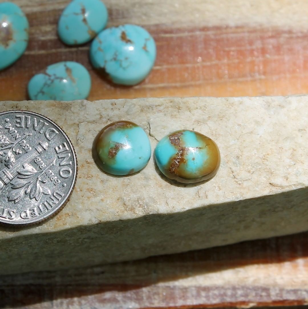 Two natural blue Stone Mountain Turquoise cabochons w/ red inclusions
 $11 for 2.2 & 1.7 carats untreated & un-backed Nevada turquoise.
