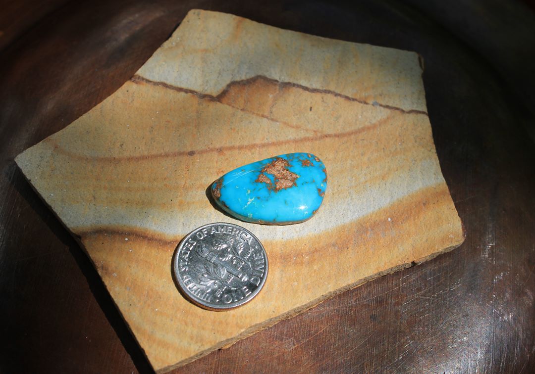 A deep blue cabochon with red matrix cut from a rare vein at Stone Mountain Mine.
$35 for 12.8 carats untreated & un-backed