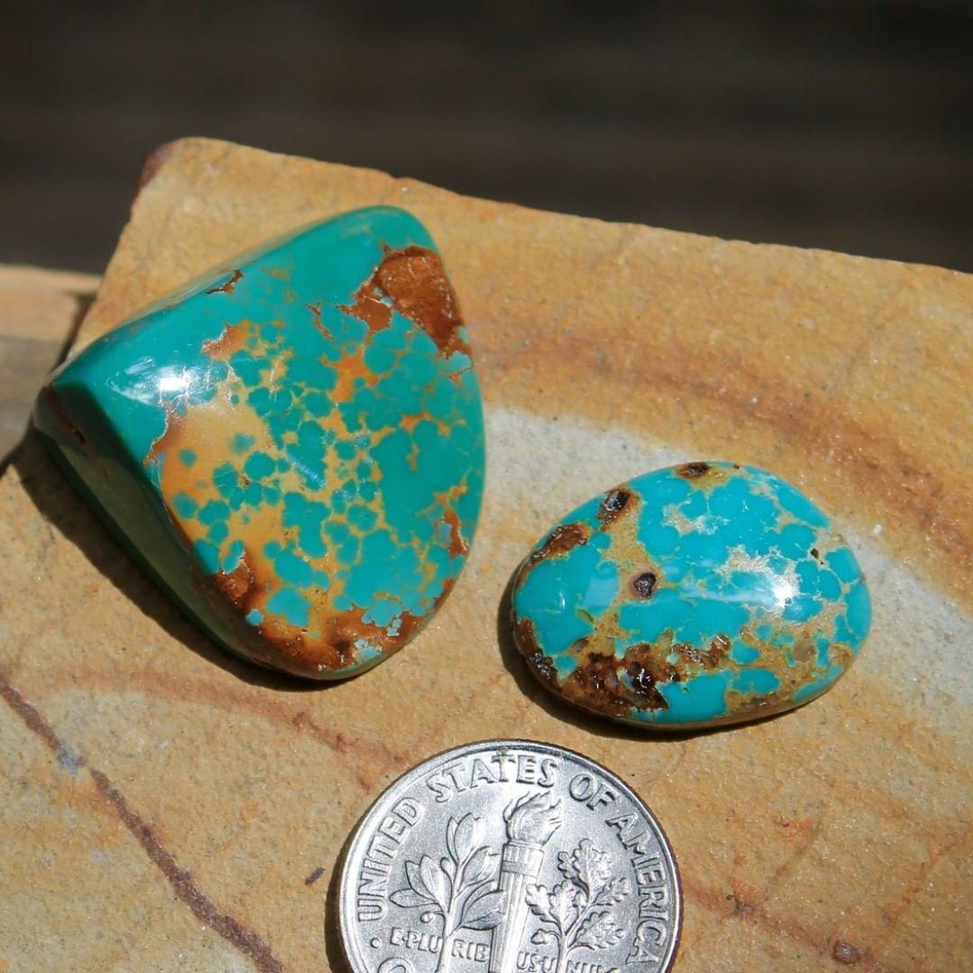 A geo-freeform cabochon and it’s smaller pal with orange to red matrix. Un-backed-solid and untreated. Truth be told I simply couldn’t force myself cut the geo-cab much smaller than it was in rough form. 

$90 for 30.6 carats, $24 for 8.6 carats
For both ($100
