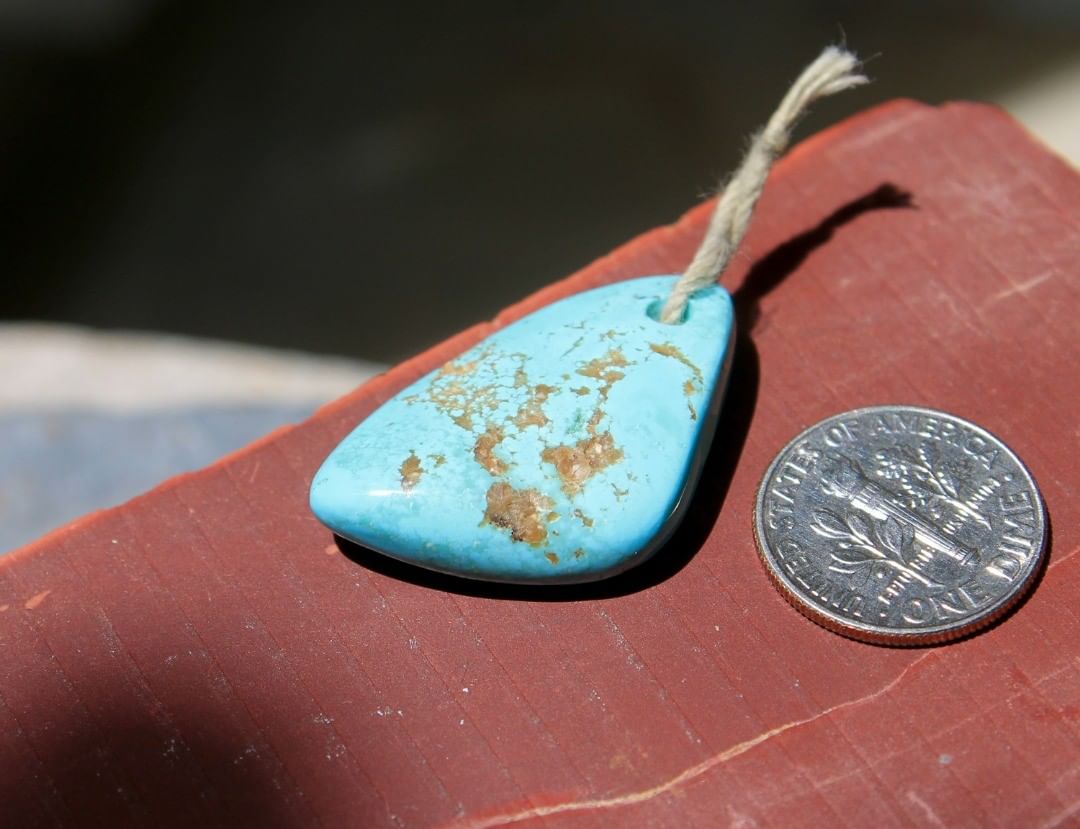 A light blue focal bead
 $72 for 26.9 carats untreated.
30×19.3×4-7 mm, 2.0 mm hole
A drilled then polished on front and back