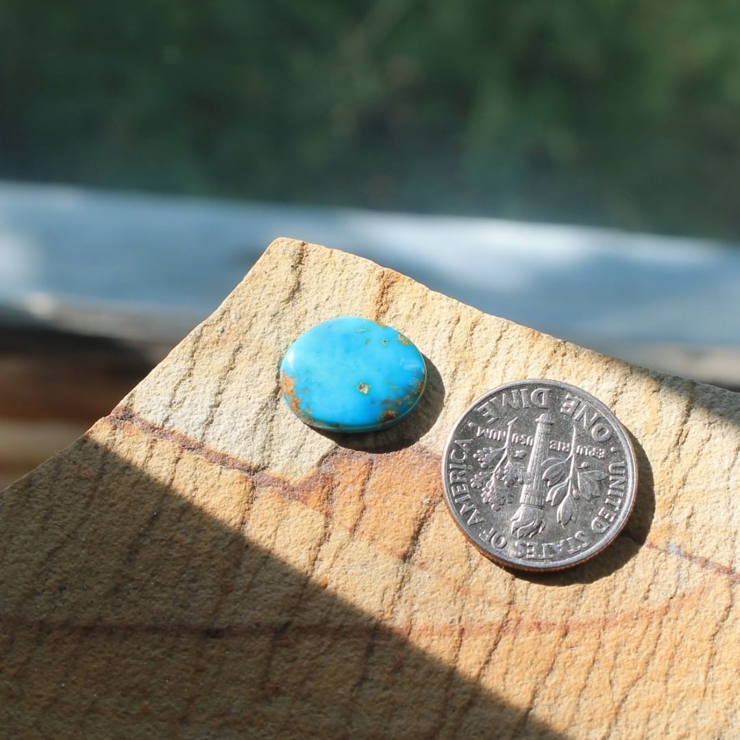 A natural blue Stone Mountain Turquoise turquoise cabochon
 $13 for 3.4 carat untreated & un-backed Nevada turquoise.
