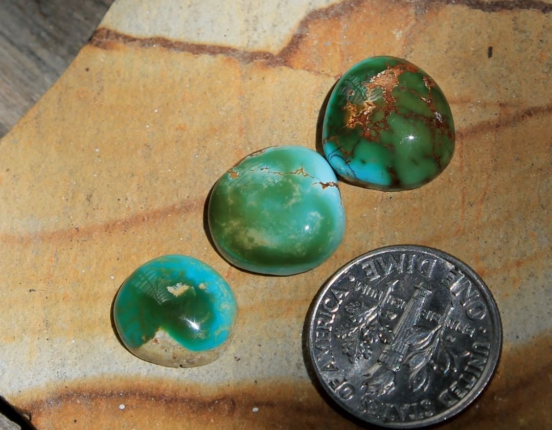 A trio of rather lumpy multi-color cabochons. Un-backed and untreated. 

(left to right)
$12 for 3.5 carats, $15 for 5.3, $16 for 5.6 carats 
Group price ($35
