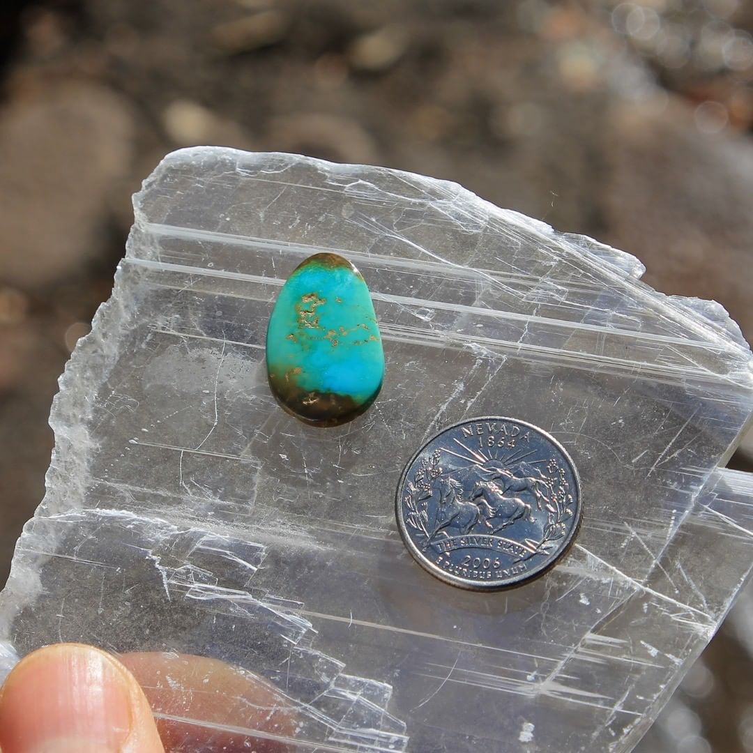 Natural blue Stone Mountain Turquoise w/ red-brown inclusions
 $30 for 10.8 carats untreated & un-backed Nevada turquoise.
