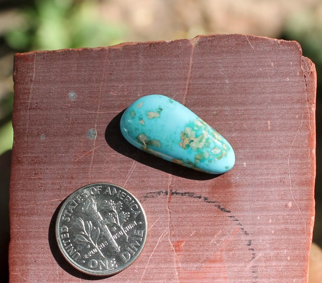 Natural blue Stone Mountain Turquoise turquoise freeform w/ quartz matrix
 $29 for 10.5 carat untreated & un-backed Nevada turquoise. 
