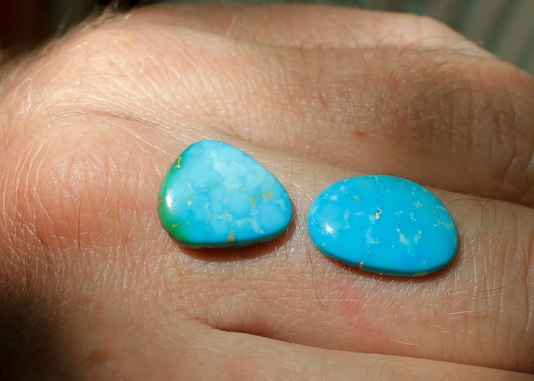 A couple natural blue cabochons with light colored inclusions. Un-backed and untreated.

$23 for 4.4 & 3.9 carats