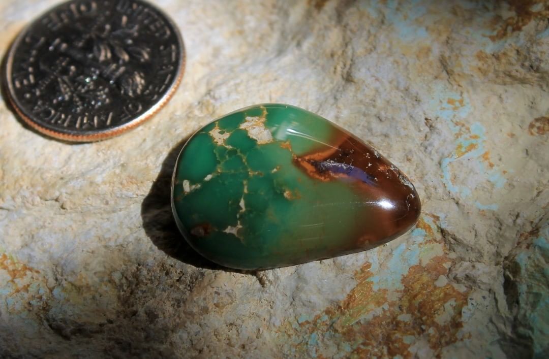 A deep green cabochon w/ red inclusions. This natural was cut from a single nugget respecting it’s original shape.

$36 for 13.6 carats un-backed & untreated