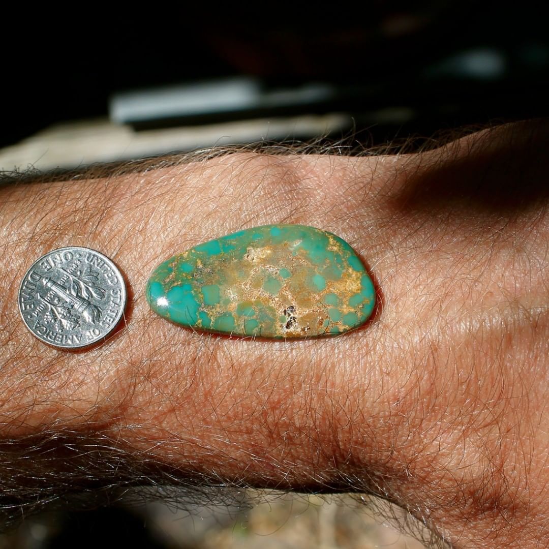 A natural green cabochon with spiderweb inclusion pattern. 

$60 for 21.4 carats un-backed and untreated