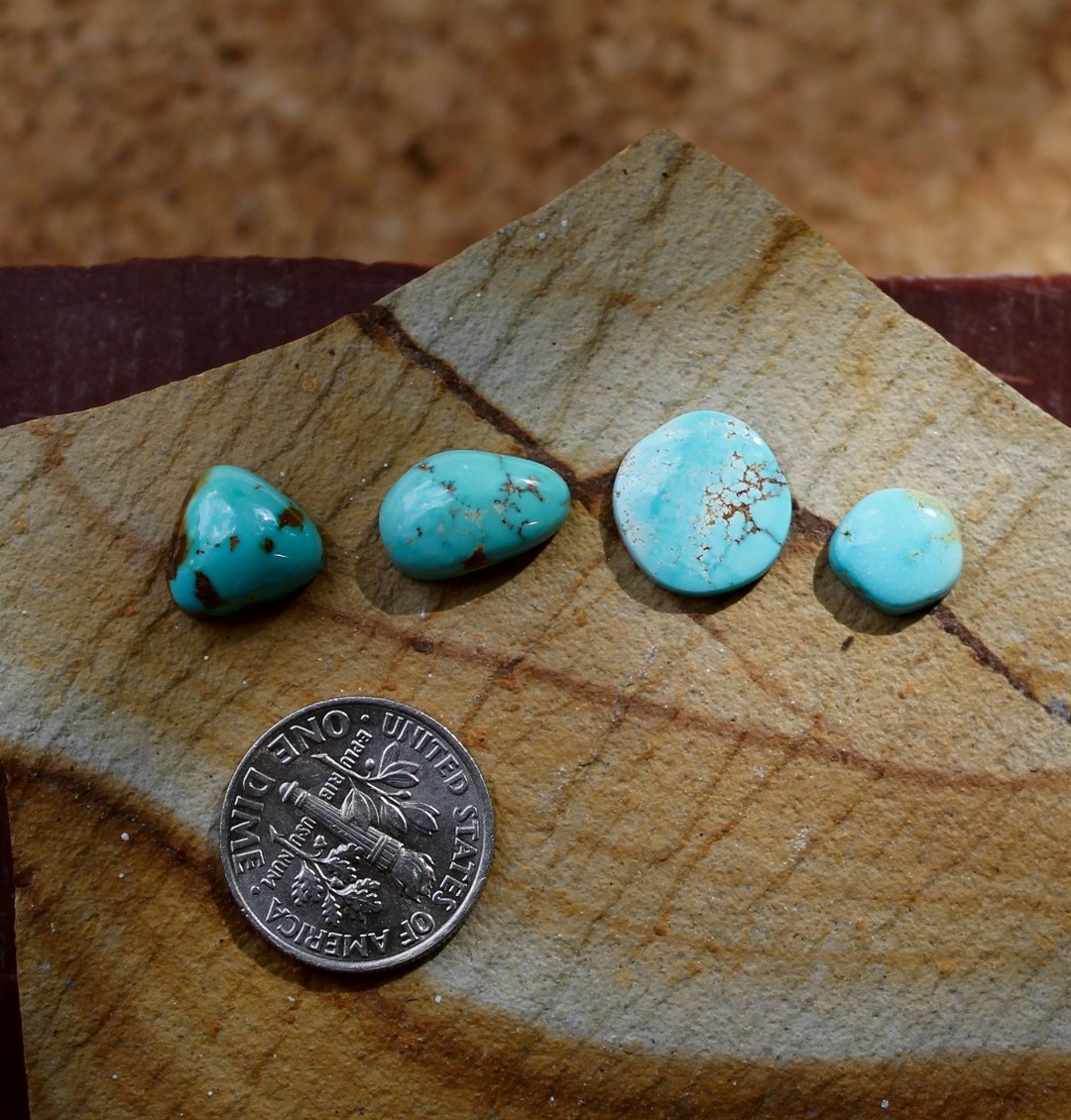 Blues contrasted by reds for these natural Stone Mountain Turquoise cabochons