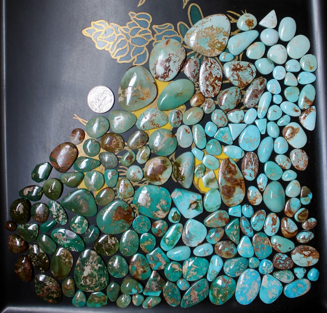 From pale blues to super dark green and everything in between for these natural Stone Mountain Turquoise cabochons in an on-desk mosaic.